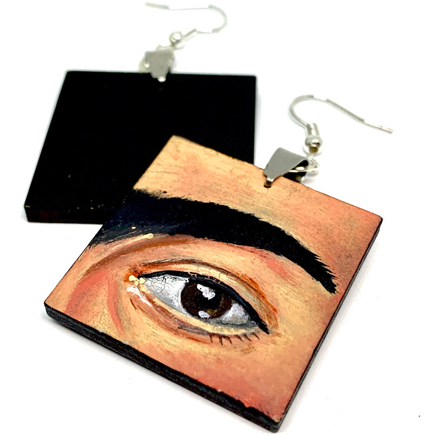 Hand painted Frida Kahlo fashion earrings. Square wooden earrings with Frida iconic eyebrows and expressive eyes. Great gift for fridamaniacs, fridalovers, fridamania, frida fans. Mexican earrings. Mexican jewelry.