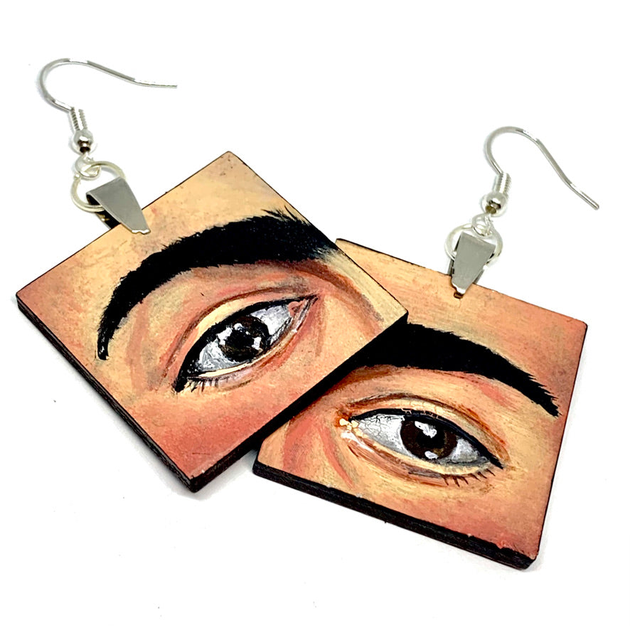 Hand painted Frida Kahlo fashion earrings. Square wooden earrings with Frida iconic eyebrows and expressive eyes. Great gift for fridamaniacs, fridalovers, fridamania, frida fans. Mexican earrings. Mexican jewelry.