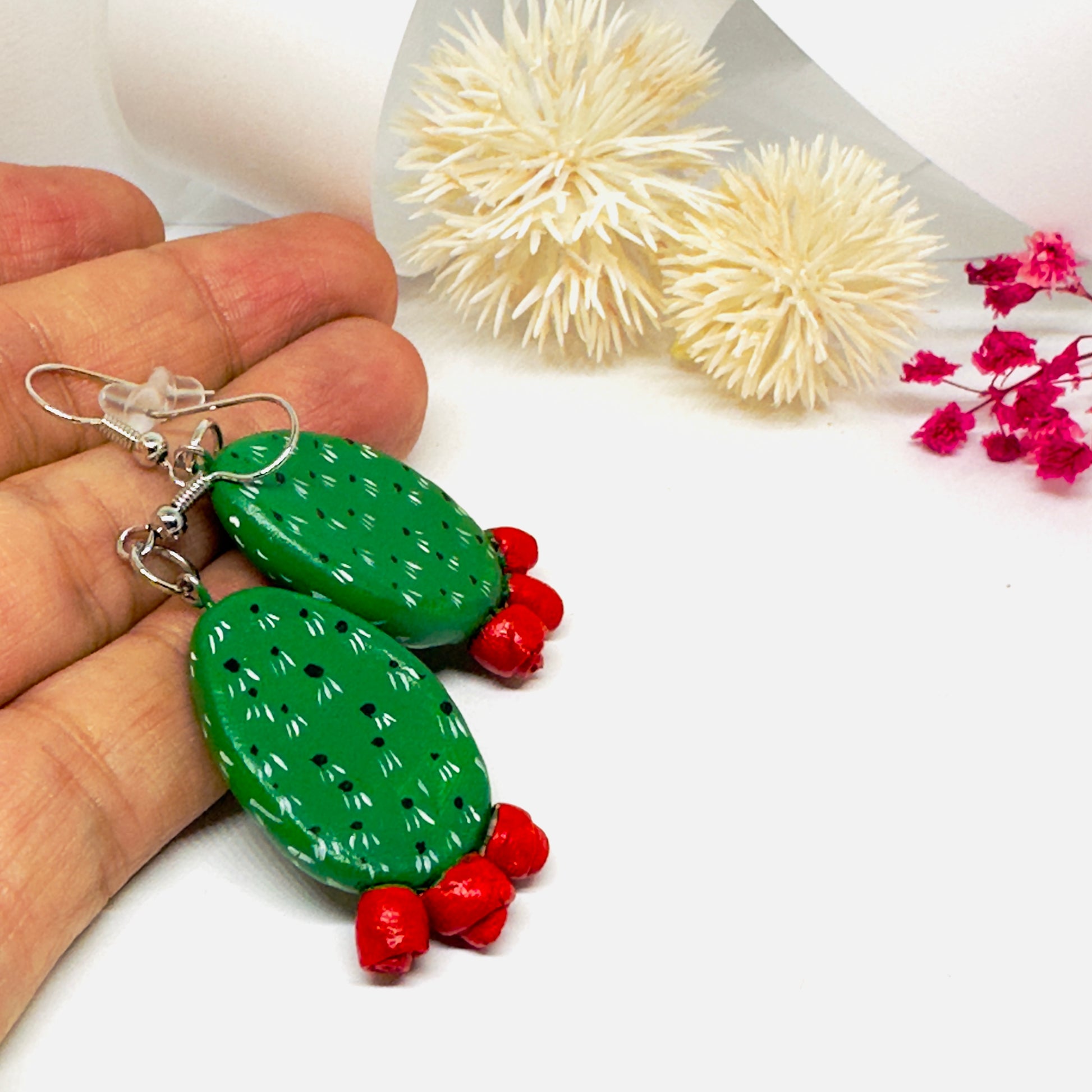 Clay cactus earrings handprinted by Mexican artisans with red cactus flowers for Mexicanias, claywelry, fridalovers, fridamaniacs, and Frida fans. Women girl gift idea.