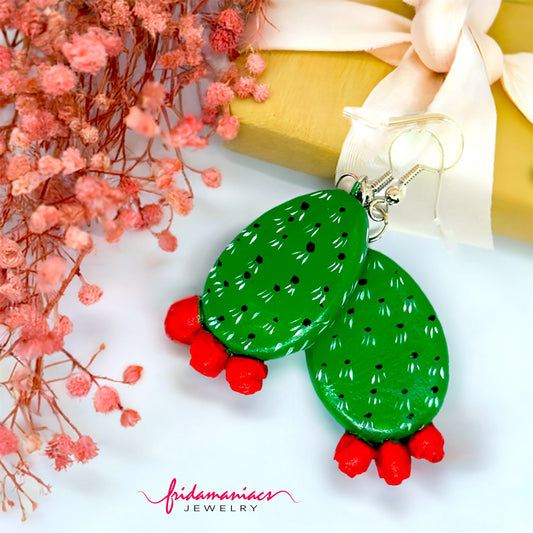 Clay cactus earrings handprinted by Mexican artisans with red cactus flowers for Mexicanias, claywelry, fridalovers, fridamaniacs, and Frida fans. Women girl gift idea.