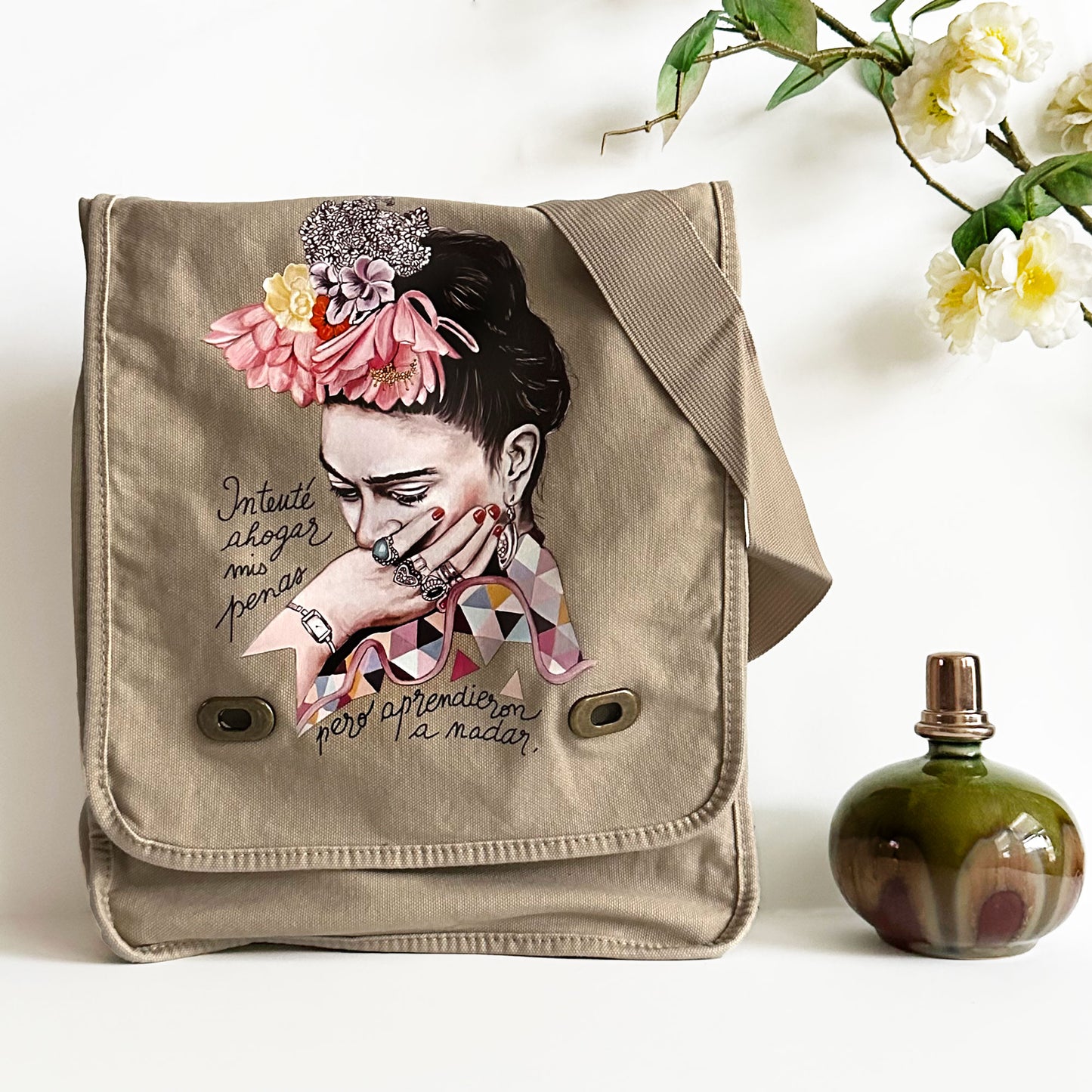 Frida Kahlo Bag: Shoulder or crossbody field bag, khaki color dyed washed soft cotton canvas fabric. Adjustable strap. Mexixcan artist floral illustration front sticker. Women and girls fashion accessory by Fridamaniacs