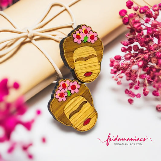 Hand painted Frida Kahlo mini bamboo stud earrings hanpainted with pink roses and red lips. Featuring iconic Mexican artist eyebrows. Mini face portrait. Cute gift idea for fridamaniacs, fridalovers, fridamania, frida fans. Mexican earrings. Mexican jewelry accessories.