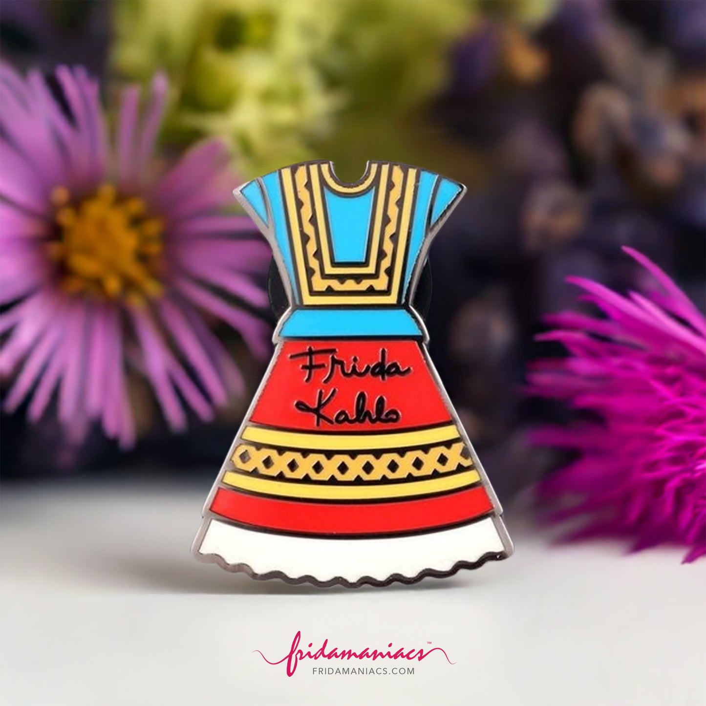 Frida Kahlo Dress Enamel Pin. Colorful red, blue, yellow, and white traditional Mexico Tehuana Oaxaca dress used by Mexican artist. With Frida Kahlo original signature on front. Cute gift idea for fridamaniacs and fridalovers.