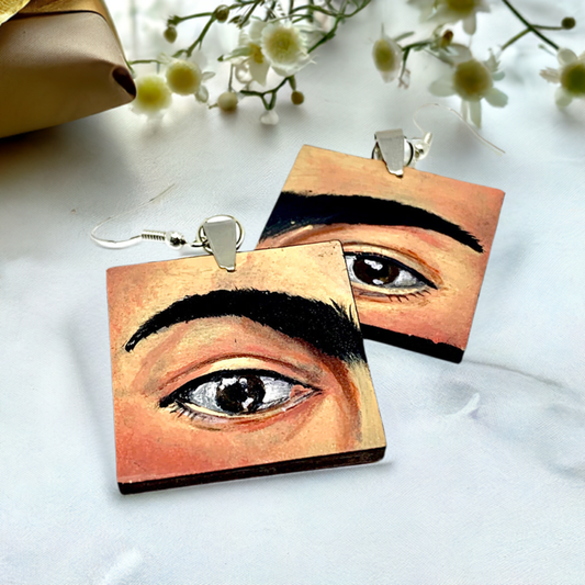 Hand painted Frida Kahlo fashion earrings. Square wooden earrings with Frida iconic eyebrows and expressive eyes. Great gift for fridamaniacs, fridalovers, fridamania, frida fans. Mexican earrings. Mexican jewelry.