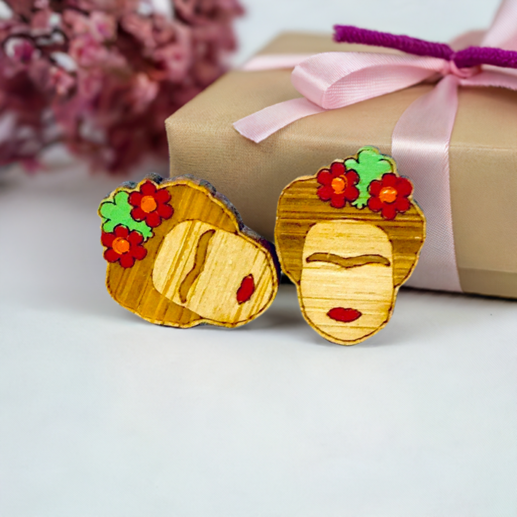Floral Mini Bamboo Frida Kahlo inspired handpainted bamboo stud earrings with red flowers, green leaves, iconic eyebrows, and red lips for fridamaniacs, fridalovers, fridamania, frida fans girls. Cool gift idea. Mexican earrings. Mexican jewelry. Cute and original women jewelry accessories.