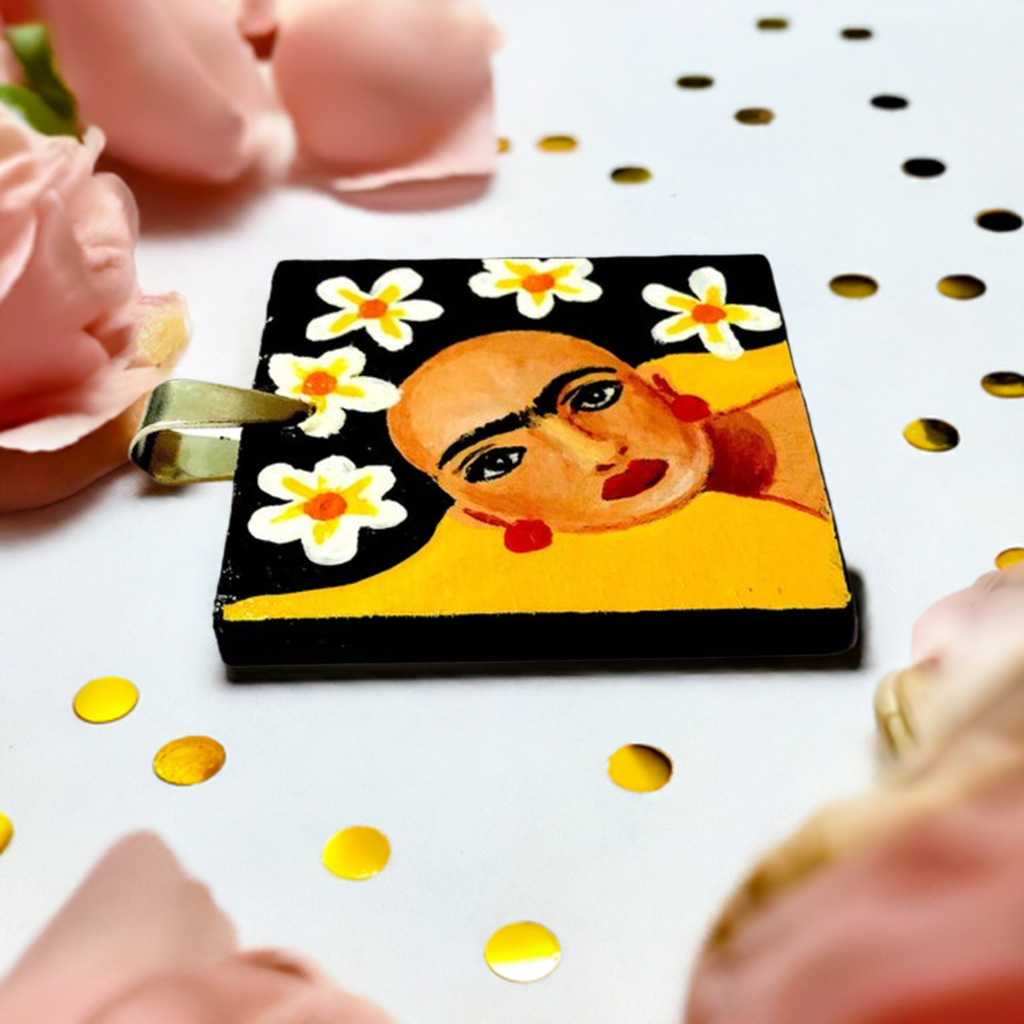 Vivid yellow hand painted Frida kahlo inspired square pendant with multicolored orange tones cords necklace. The painitng shows Frida Kahlo inspired face with iconic eyebrows and flowers. Fridamaniacs, fridalovers, and frida fans gift idea. Girl Mexican jewelry and necklace
