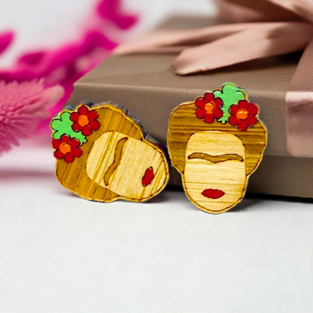 Floral Mini Bamboo Frida Kahlo inspired handpainted bamboo stud earrings with red flowers, green leaves, iconic eyebrows, and red lips for fridamaniacs, fridalovers, fridamania, frida fans girls. Cool gift idea. Mexican earrings. Mexican jewelry. Cute and original women jewelry accessories.