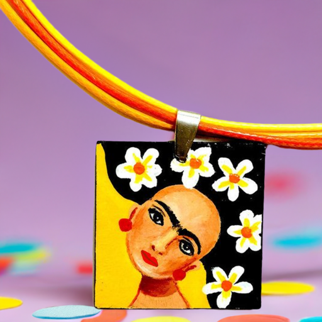 Vivid yellow hand painted Frida kahlo inspired square pendant with multicolored orange tones cords necklace. The painitng shows Frida Kahlo inspired face with iconic eyebrows and flowers. Fridamaniacs, fridalovers, and frida fans gift idea. Girl Mexican jewelry and necklace