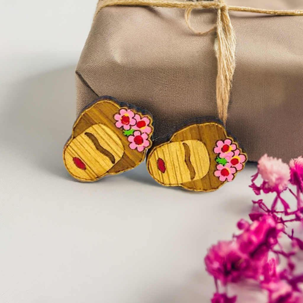 Hand painted Frida Kahlo mini bamboo stud earrings hanpainted with pink roses and red lips. Featuring iconic Mexican artist eyebrows. Mini face portrait. Cute gift idea for fridamaniacs, fridalovers, fridamania, frida fans. Mexican earrings. Mexican jewelry accessories.