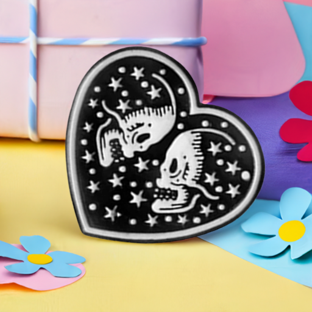 Black Heart with two white skull lovers and stars. Love to die for. Enamel pin back button by Calacamaia. Skull Jewelry accessory