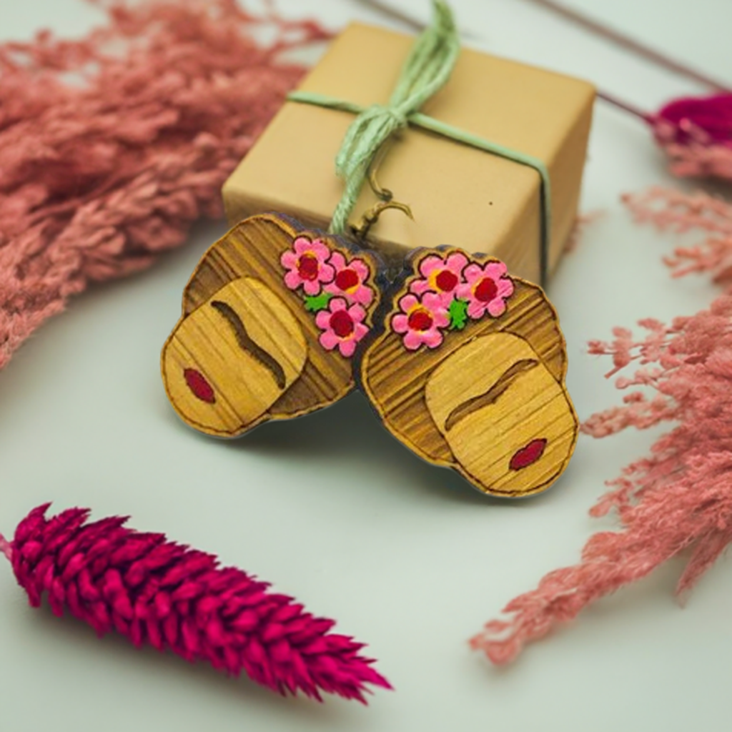 Hand painted Frida Kahlo mini bamboo stud earrings hanpainted with pink roses and red lips. Featuring iconic Mexican artist eyebrows. Mini face portrait. Cute gift idea for fridamaniacs, fridalovers, fridamania, frida fans. Mexican earrings. Mexican jewelry accessories.