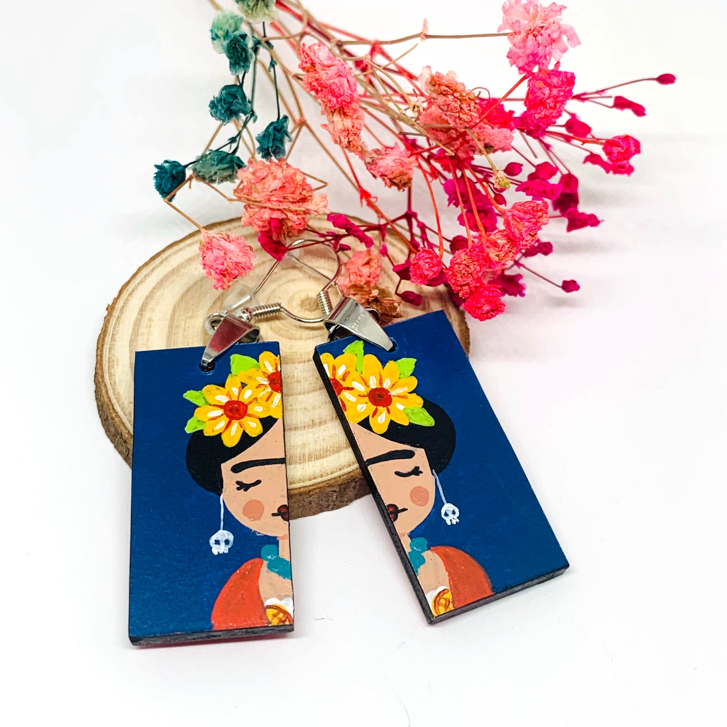Frida Earrings: Hand painted Frida Kahlo earrings made of wood. Mexican jewelry. Acrylic blue indigo, orange, and yellow flowers. Girl gift idea. Trendy fashion. Aretes pintados a mano. Mexico folk art to wear-wearable art. Women and girls birthday gift idea