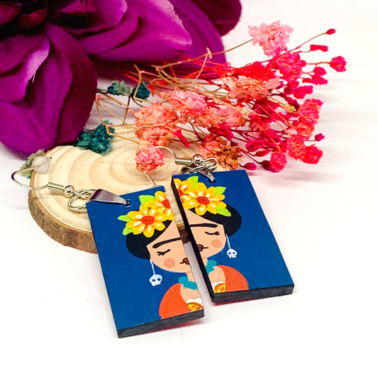 Frida Earrings: Hand painted Frida Kahlo earrings made of wood. Mexican jewelry. Acrylic blue indigo, orange, and yellow flowers. Girl gift idea. Trendy fashion. Aretes pintados a mano. Mexico folk art to wear-wearable art. Women and girls birthday gift idea