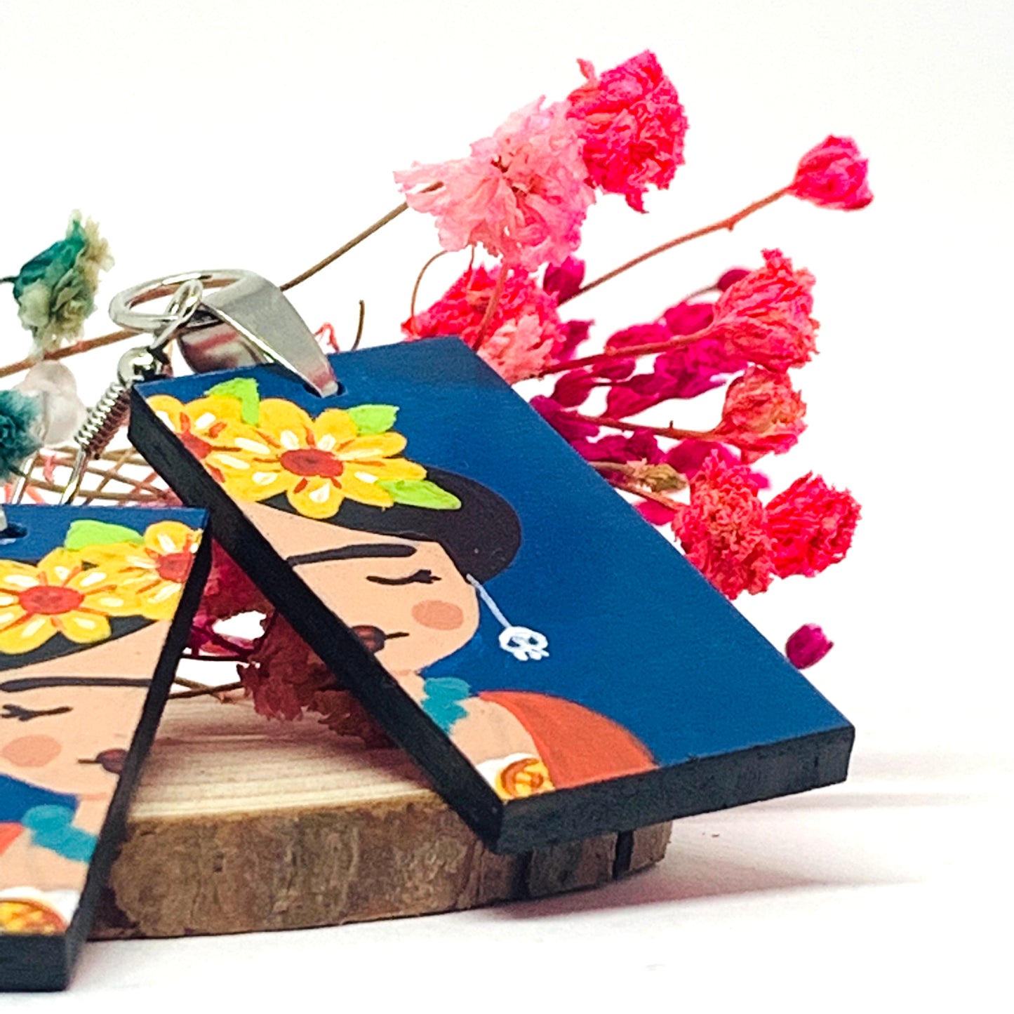 Frida Earrings: Hand painted Frida Kahlo earrings made of wood. Mexican jewelry. Acrylic blue indigo, orange, and yellow flowers. Girl gift idea. Trendy fashion. Aretes pintados a mano. Mexico folk art to wear-wearable art. Women and girls birthday gift idea