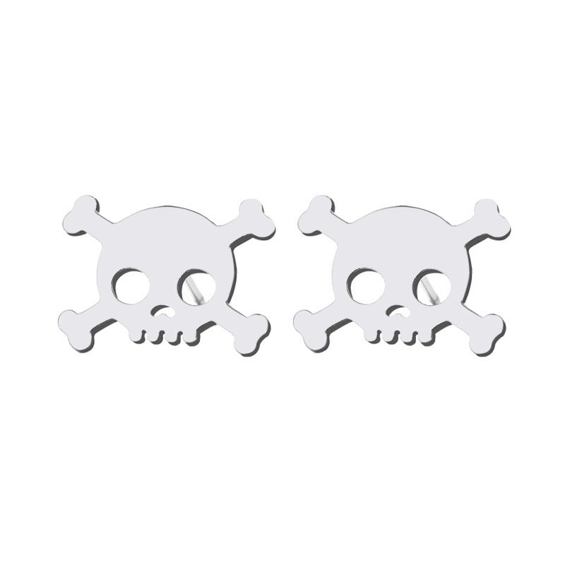 Mexican silver skull earrings. Mini stud silver pendants by fridamaniacs jewelry and accessories
