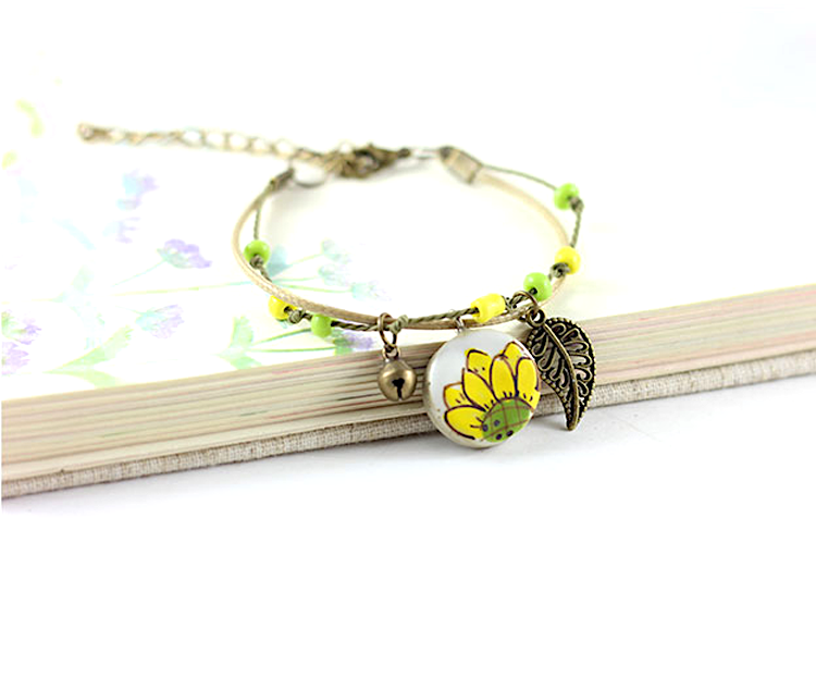 Sunflower Clay Bracelet: Hand painted and handmade ceramic sunflower wristband bracelet for women and girls inspired by Frida Kahlo and Mexican Folk Art Jewelry