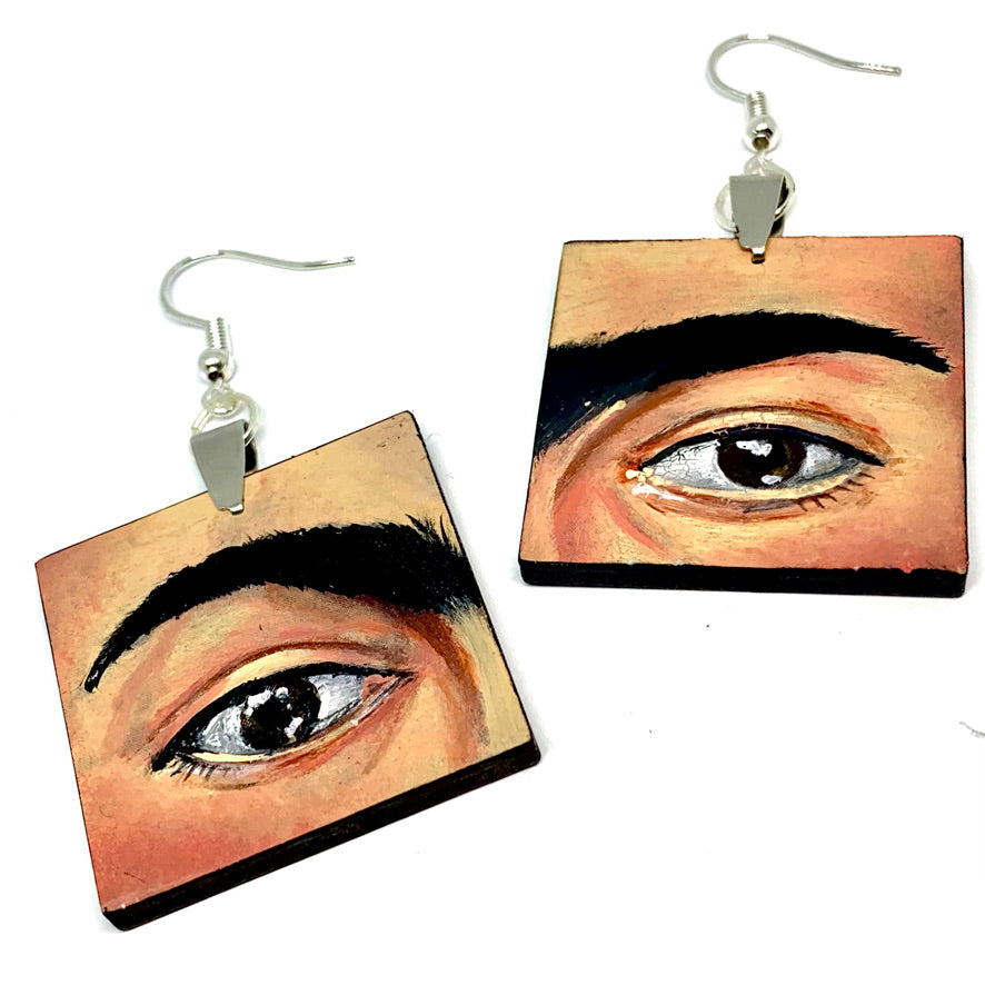 Hand painted Frida Kahlo fashion earrings. Square wooden earrings with Frida iconic eyebrows and expressive eyes. Great gift for fridamaniacs, fridalovers, fridamania, frida fans. Mexican earrings. Mexican jewelry.