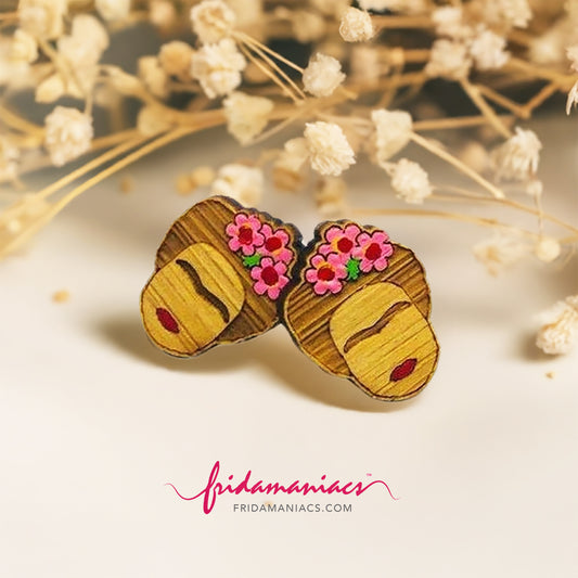Mexican earrings painted by hand featuring Frida Kahlo with pink flowers, eyebrows, and red lips. Mexican jewelry. Laser cut wooden bamboo stud earrings for fridamaniacs, fridalovers, fridamnia, frida fans girls gift idea.