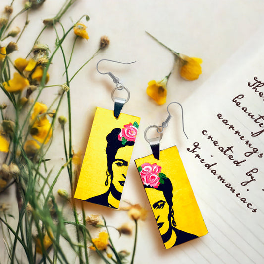 Frida Kahlo inspired yellow stencil art earrings with pink roses and black painted artist portrait face for fridamaniacs, fridalovers, fridamania, frida fans girls. Cute gift idea