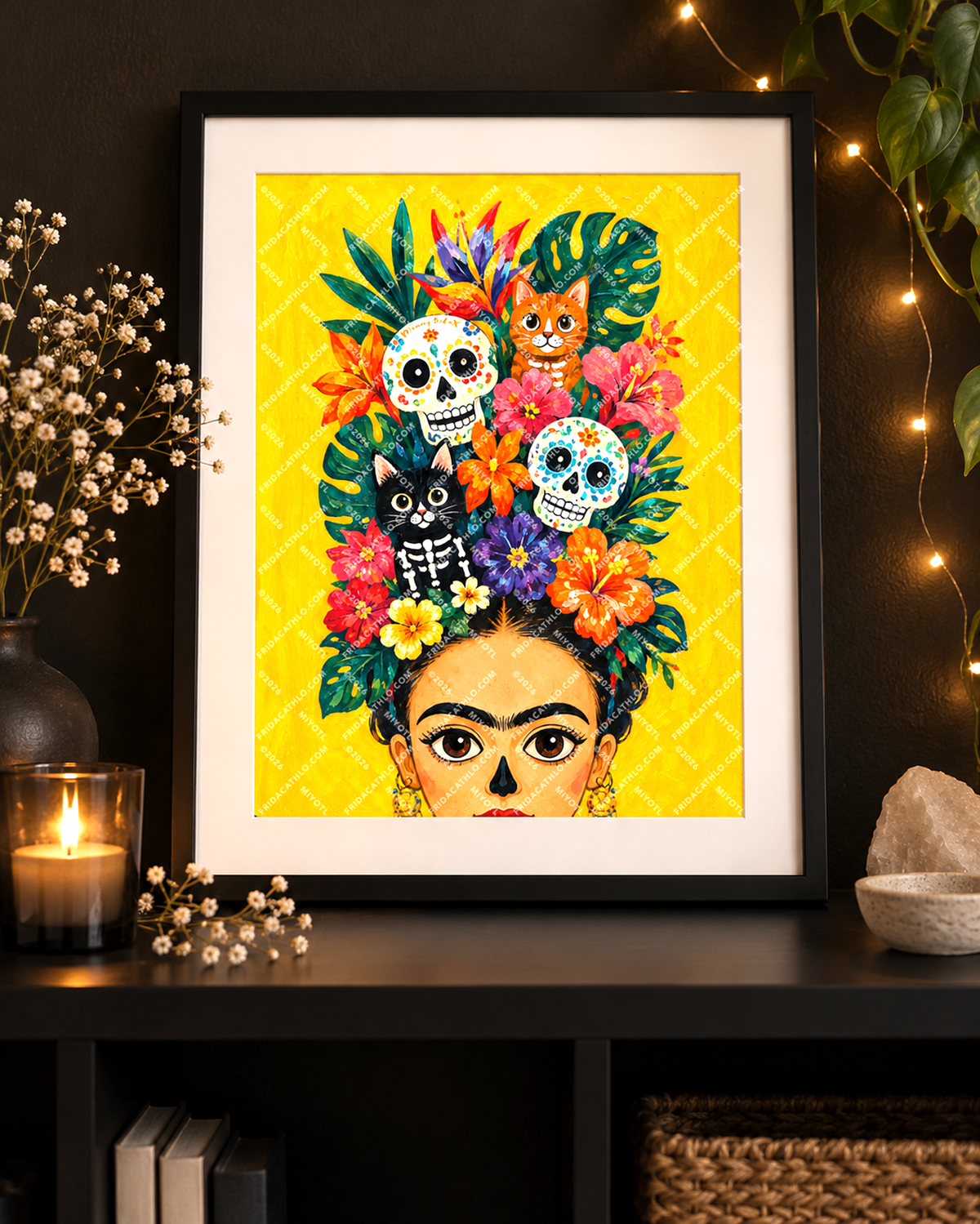 A framed art print featuring a colorful Day of the Dead style portrait of Frida Kahlo with flowers, skulls, and animals on a bright yellow background, displayed on a dark shelf in a styled room setting. Frida Kahlo inspired floral art with skeleton cats and Mexican sugar skulls. Dia de Muertos. Mexico folk art imagery 