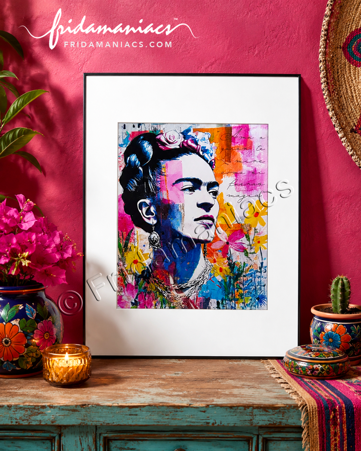 Framed artwork of a colorful Frida Kahlo portrait with floral elements on a pink wall.