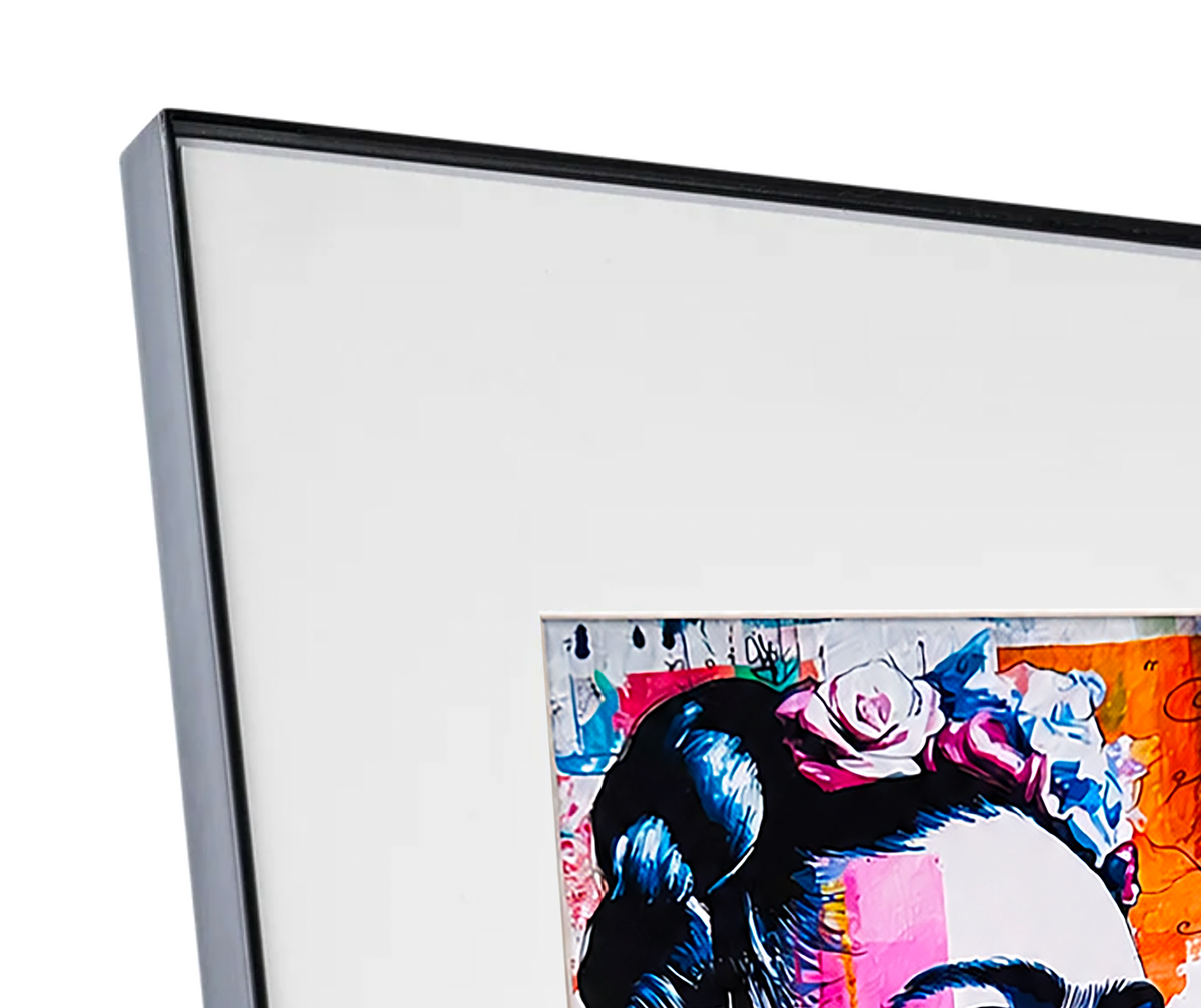 Framed artwork with a colorful Frida Kahlo design on a white background