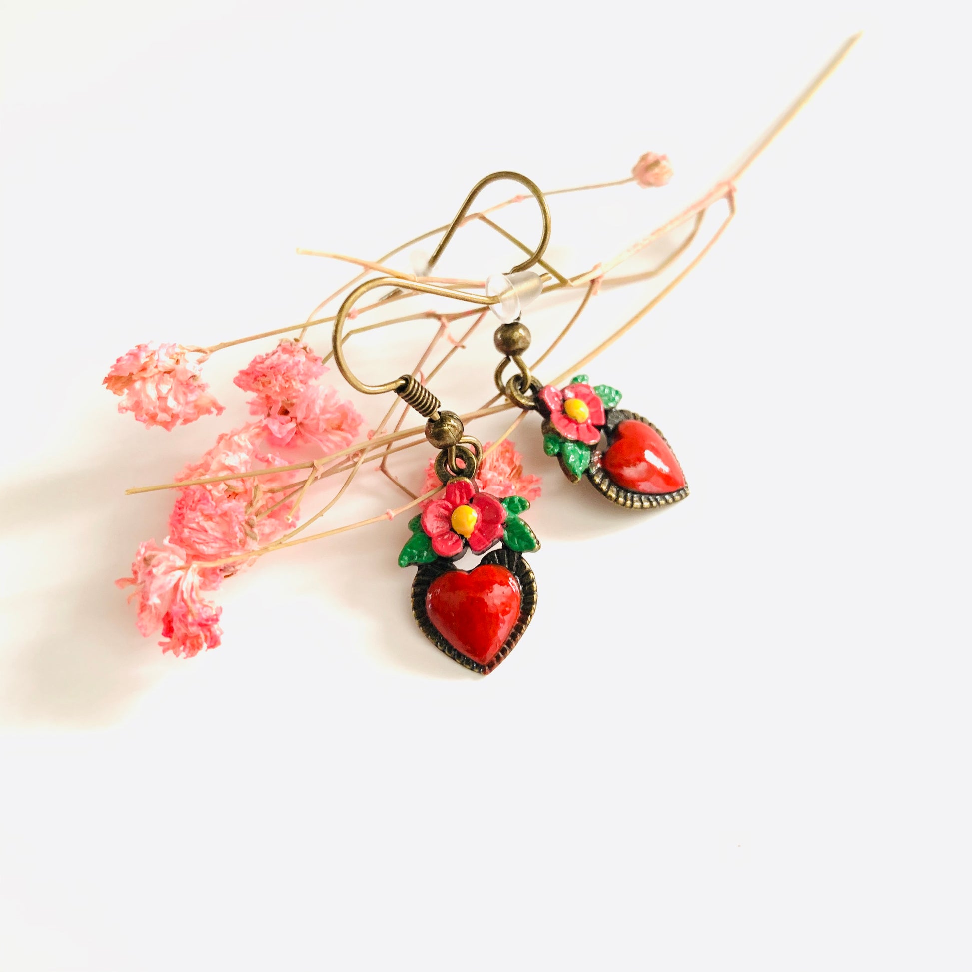 Bronze hand painted heart and flower earrings. Red, pink, green, and yellow paint. Mexican earrings. Mexican jewelry for fridamaniacs, fridalovers, fridamania. Frida Kahlo. Mother's Day gift.