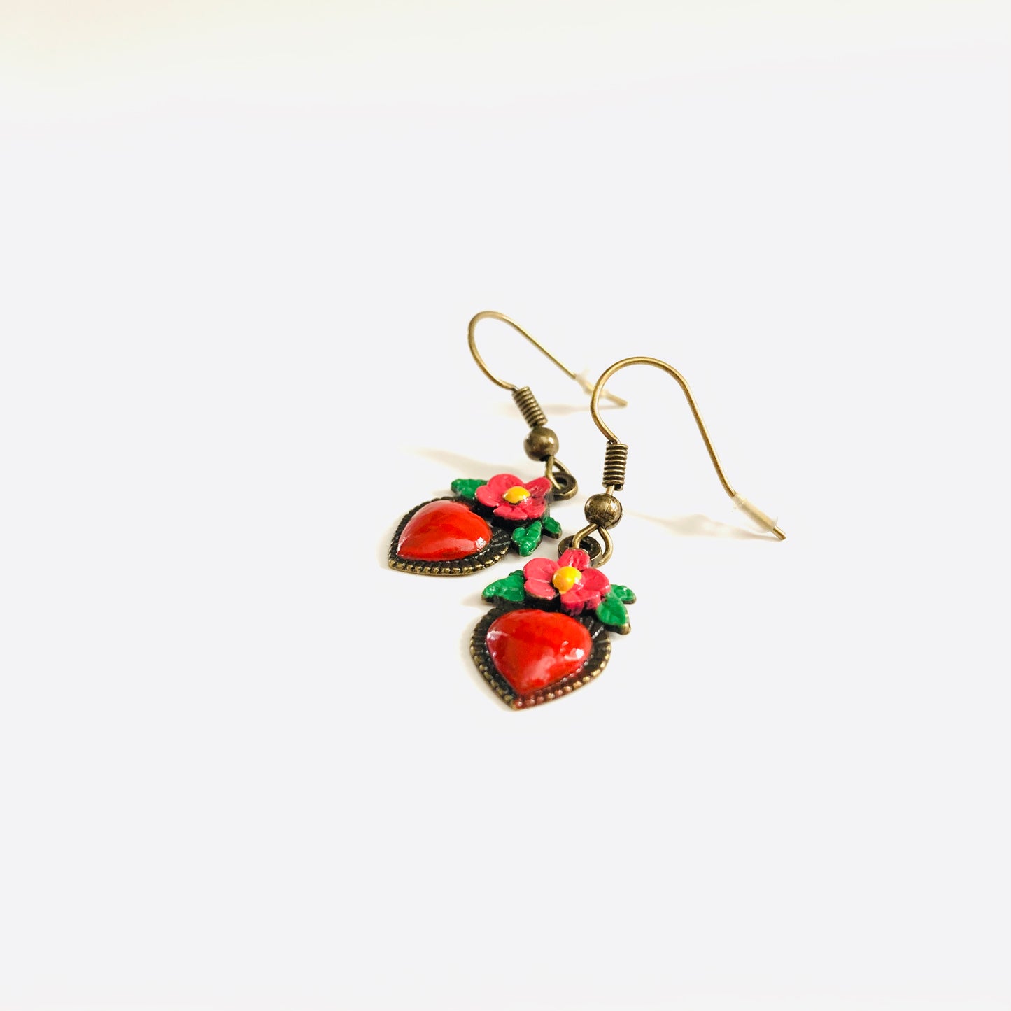 Bronze hand painted heart and flower earrings. Red, pink, green, and yellow paint. Mexican earrings. Mexican jewelry for fridamaniacs, fridalovers, fridamania. Frida Kahlo. Mother's Day gift.