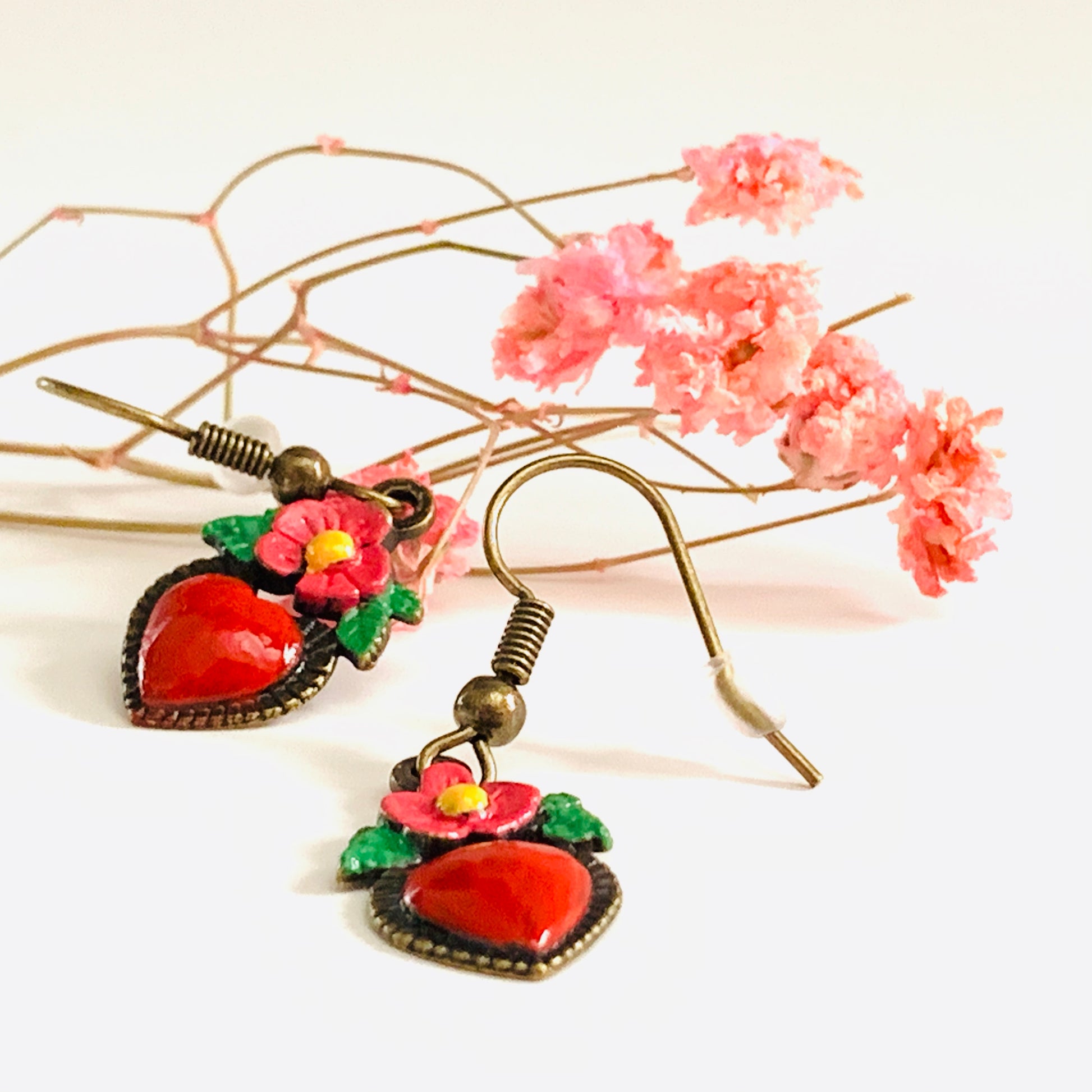 Bronze hand painted heart and flower earrings. Red, pink, green, and yellow paint. Mexican earrings. Mexican jewelry for fridamaniacs, fridalovers, fridamania. Frida Kahlo. Mother's Day gift.