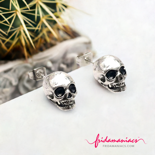 Mexican silver earrings skull rustic.png