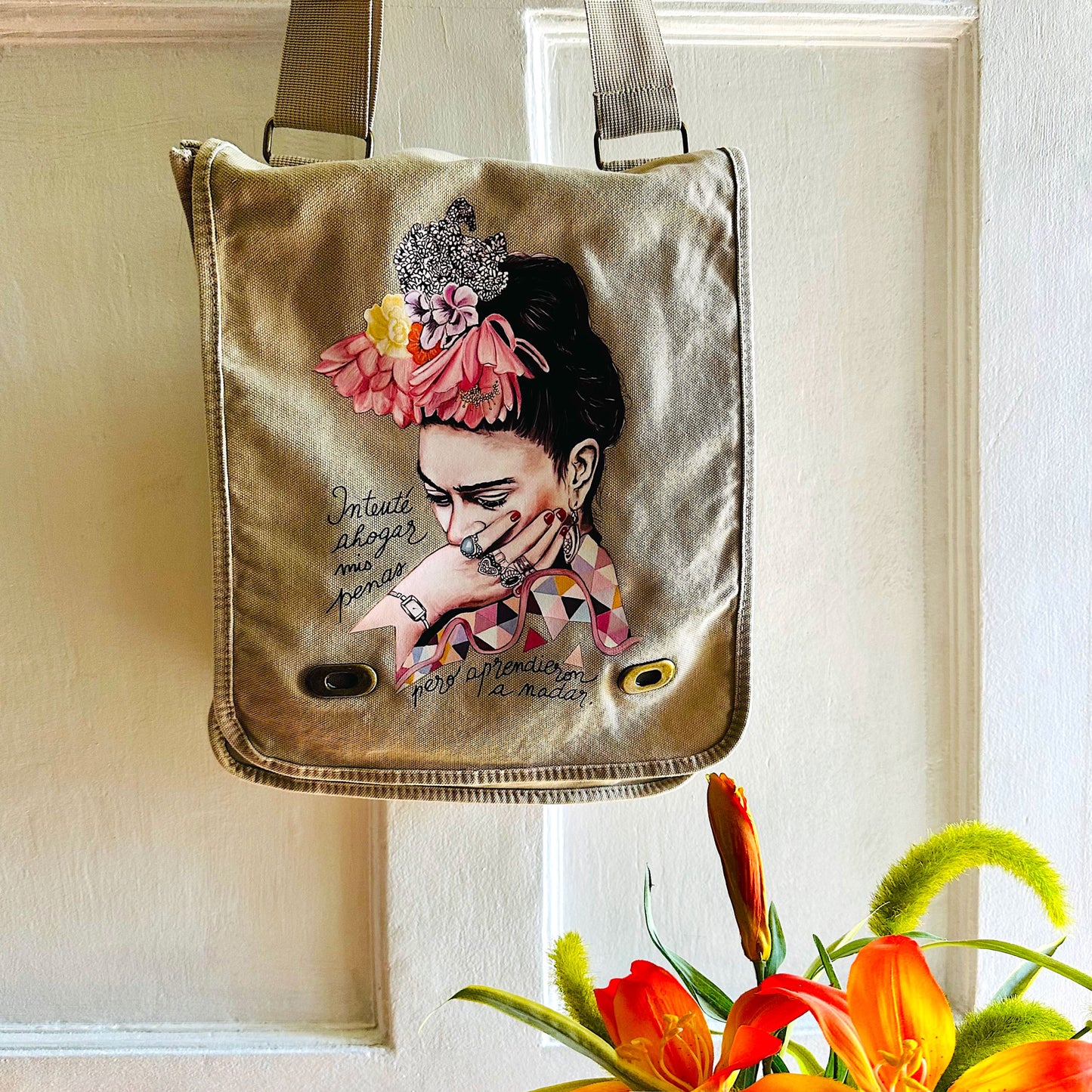 Frida Kahlo Bag: Shoulder or crossbody field bag, khaki color dyed washed soft cotton canvas fabric. Adjustable strap. Mexixcan artist floral illustration front sticker. Women and girls fashion accessory by Fridamaniacs