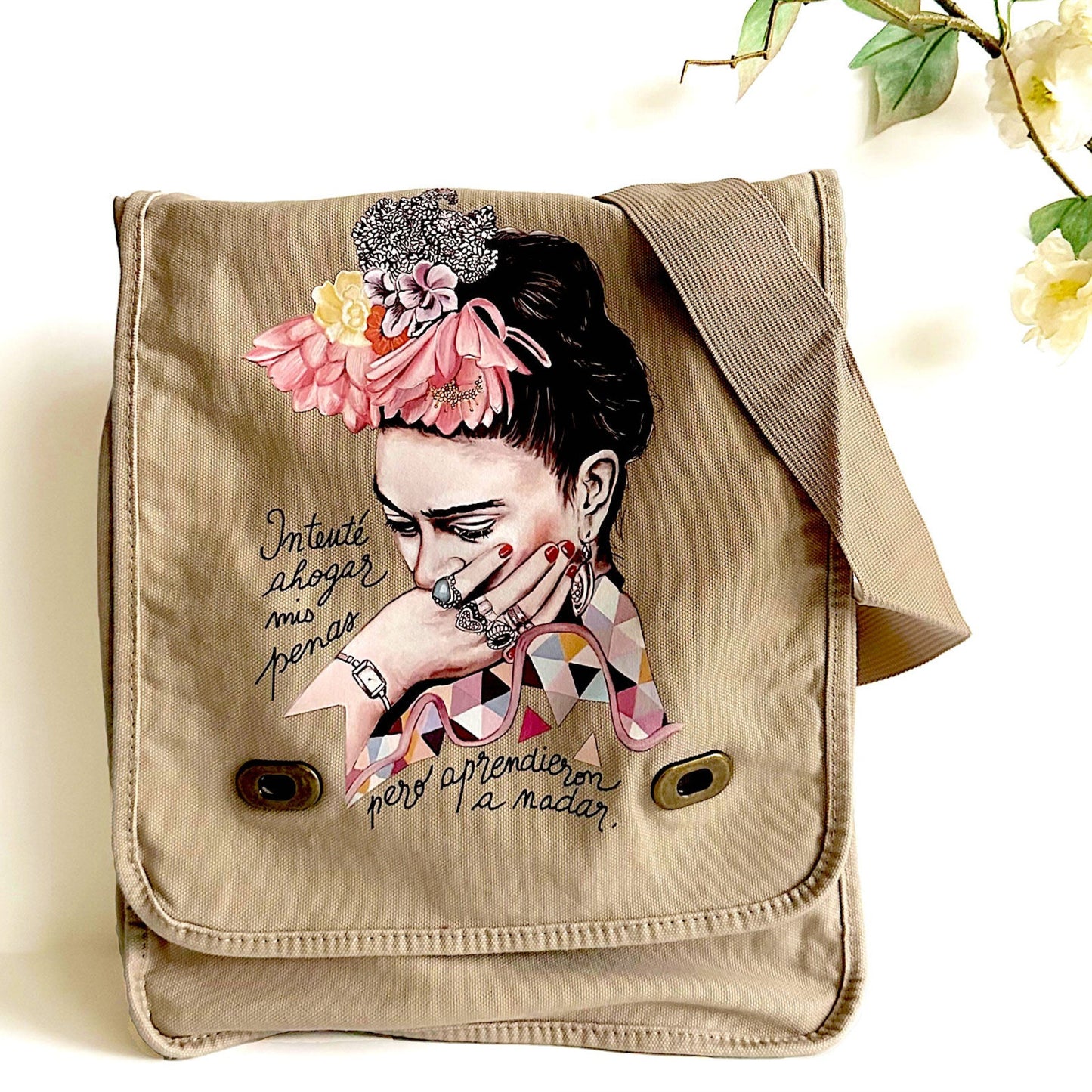 Frida Kahlo Bag: Shoulder or crossbody field bag, khaki color dyed washed soft cotton canvas fabric. Adjustable strap. Mexixcan artist floral illustration front sticker. Women and girls fashion accessory by Fridamaniacs