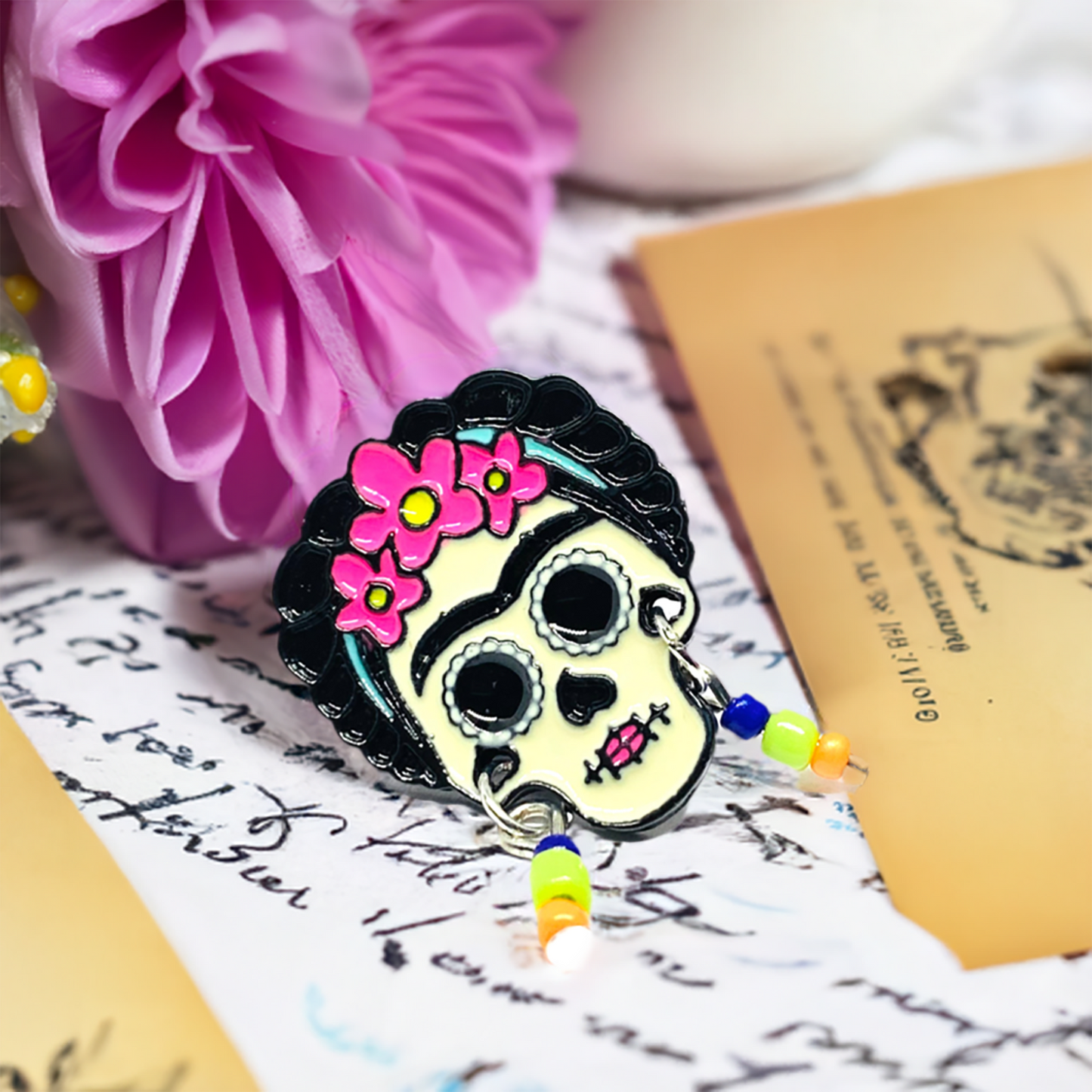 Cute Frida Kahlo enamel pin Day of the dead with beaded earrings. Cute, colorful, and original.