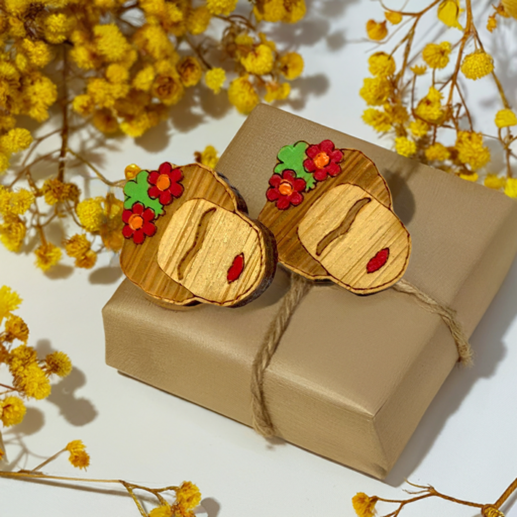 Mini Bamboo Frida Kahlo Earrings. Hand painted wooden stud earrings inspired by Frida with red flowers. Mexican artist iconic portrait face with red lips and eyebrows for fridamaniacs, fridalovers, fridamania, and frida fans. Cute gift idea.