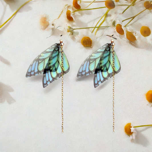 Translucid blue-green ish butterfly earrings with gold tone ear wires and long chain. Ideal gift idea for Frida Kahlo fans. Mexican Earrings. Mexican jewelry for girls. Magical spring summer fashion for girls. Cute gift idea.
