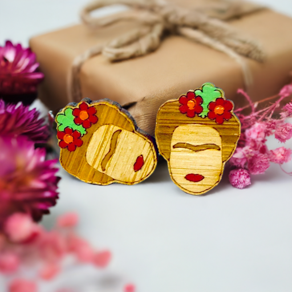 Floral Mini Bamboo Frida Kahlo inspired handpainted bamboo stud earrings with red flowers, green leaves, iconic eyebrows, and red lips for fridamaniacs, fridalovers, fridamania, frida fans girls. Cool gift idea. Mexican earrings. Mexican jewelry. Cute and original women jewelry accessories.