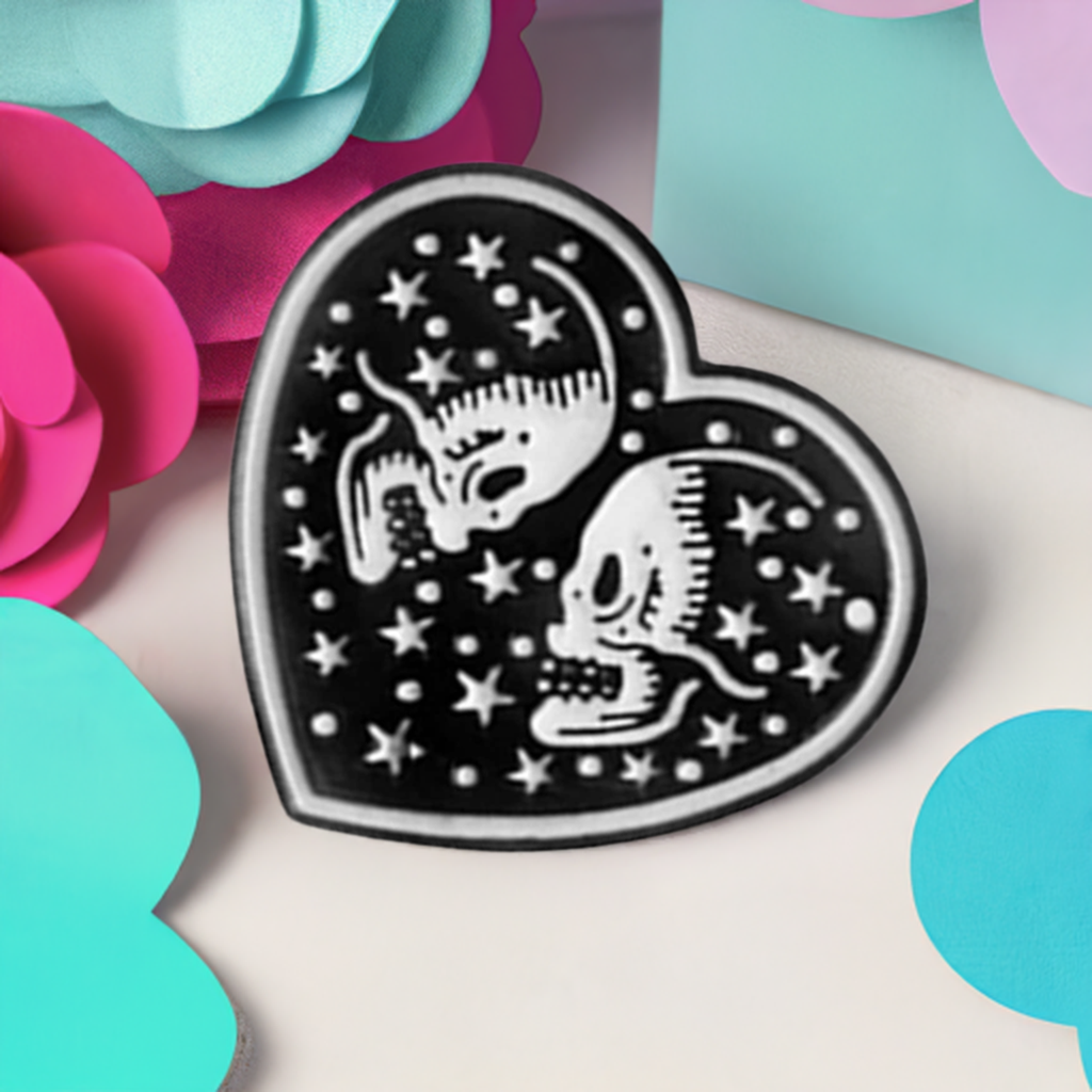 Black Heart with two white skull lovers and stars. Love to die for. Enamel pin back button by Calacamaia. Skull Jewelry accessory