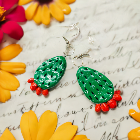 Handmade and hand painted cactus clay earrings. Fresh green and fire vivid red cactus flowers. Handcrafted by Mexican artisans. This cactus feature carved spikes. Mexico folk art for women and girls. Mexican earrings. Mexico jewelry.
