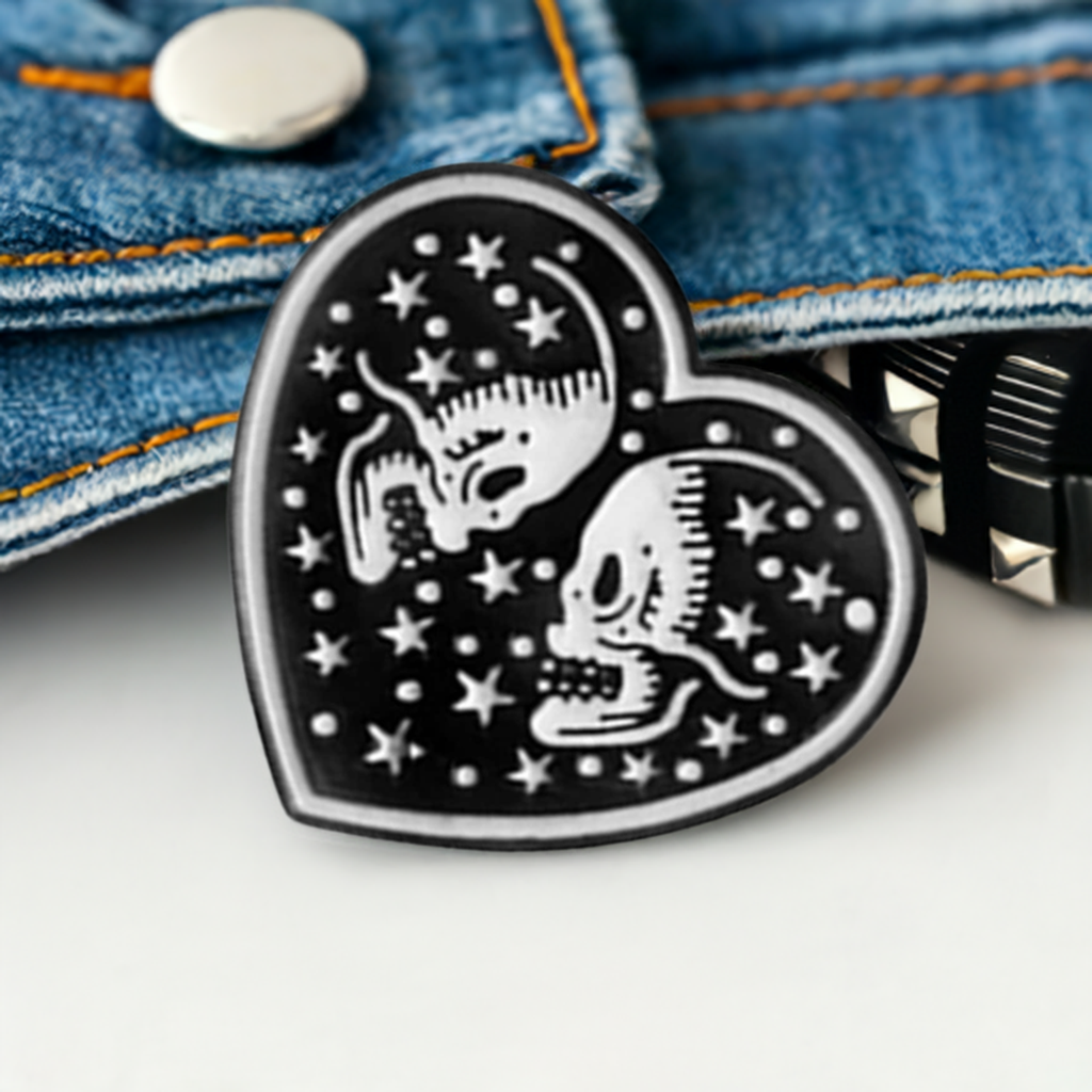 Black Heart with two white skull lovers and stars. Love to die for. Enamel pin back button by Calacamaia. Skull Jewelry accessory