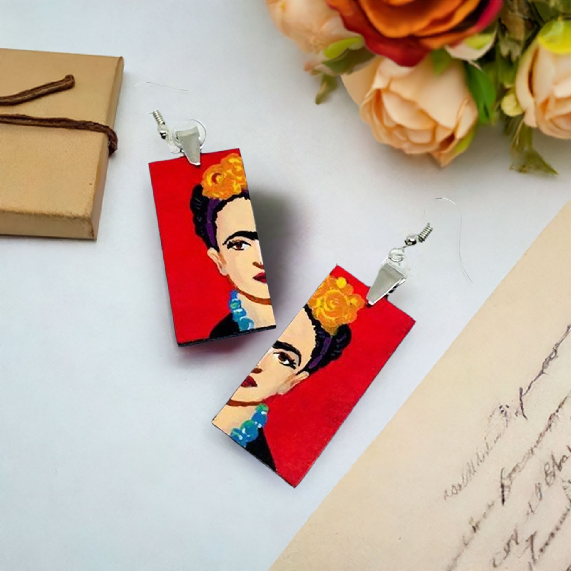 Handpainted Frida Kahlo inspired wooden earrings. Mexican iconic artist portrait split rectangular vivid red and silver ear wires for fridamaniacs, fridalovers, frida fans, fridamania girls gift idea