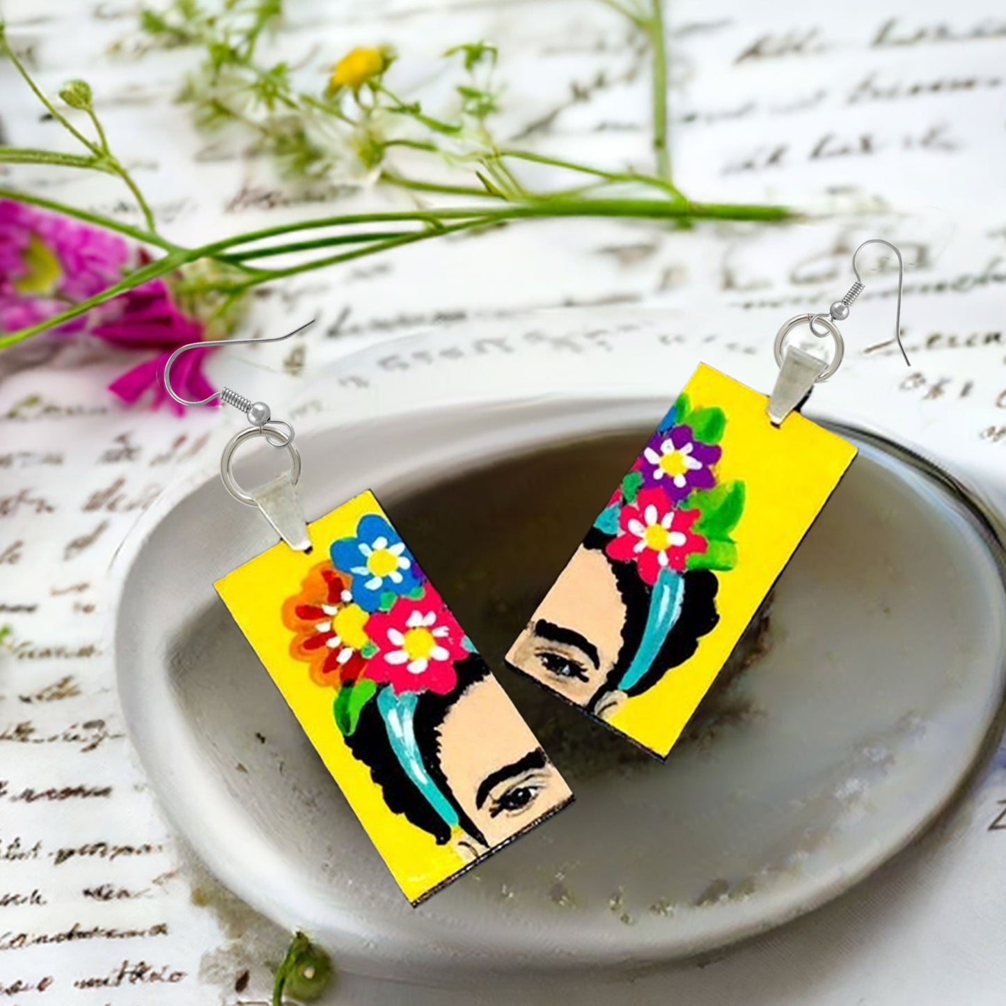 Vivid Frida Kahlo inspired floral earrings painted by hand by Mexican artisan. Mexico folk art to wear for women and girls. Mexico jewelry. Mexican earrings. Frida fans. Mexicanias. Fridamaniacs. Fridalovers. Great gift idea young girls.