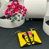 Frida Kahlo Stencil Art with Yellow Background and Hand Painted Pink Roses. Wearable art for girls. Cute and original gift idea. Floral jewelry inspired Mexican Artist and Mexico Folk Art. Aretes Frida Kahlo Amarillos con Rosas para Mujer.