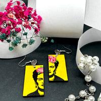 Frida Kahlo Stencil Art with Yellow Background and Hand Painted Pink Roses. Wearable art for girls. Cute and original gift idea. Floral jewelry inspired Mexican Artist and Mexico Folk Art. Aretes Frida Kahlo Amarillos con Rosas para Mujer.