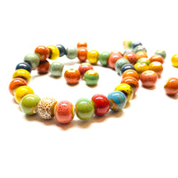 Beaded Ceramic Bracelet: Handmade unisex wristband bracelet made of colorful clay ceramic beads by Fridamaniacs for Fridalovers. Frida Kahlo inspired Mexican jewelry. Brazalete de ceramica hecho a mano por Claywelry