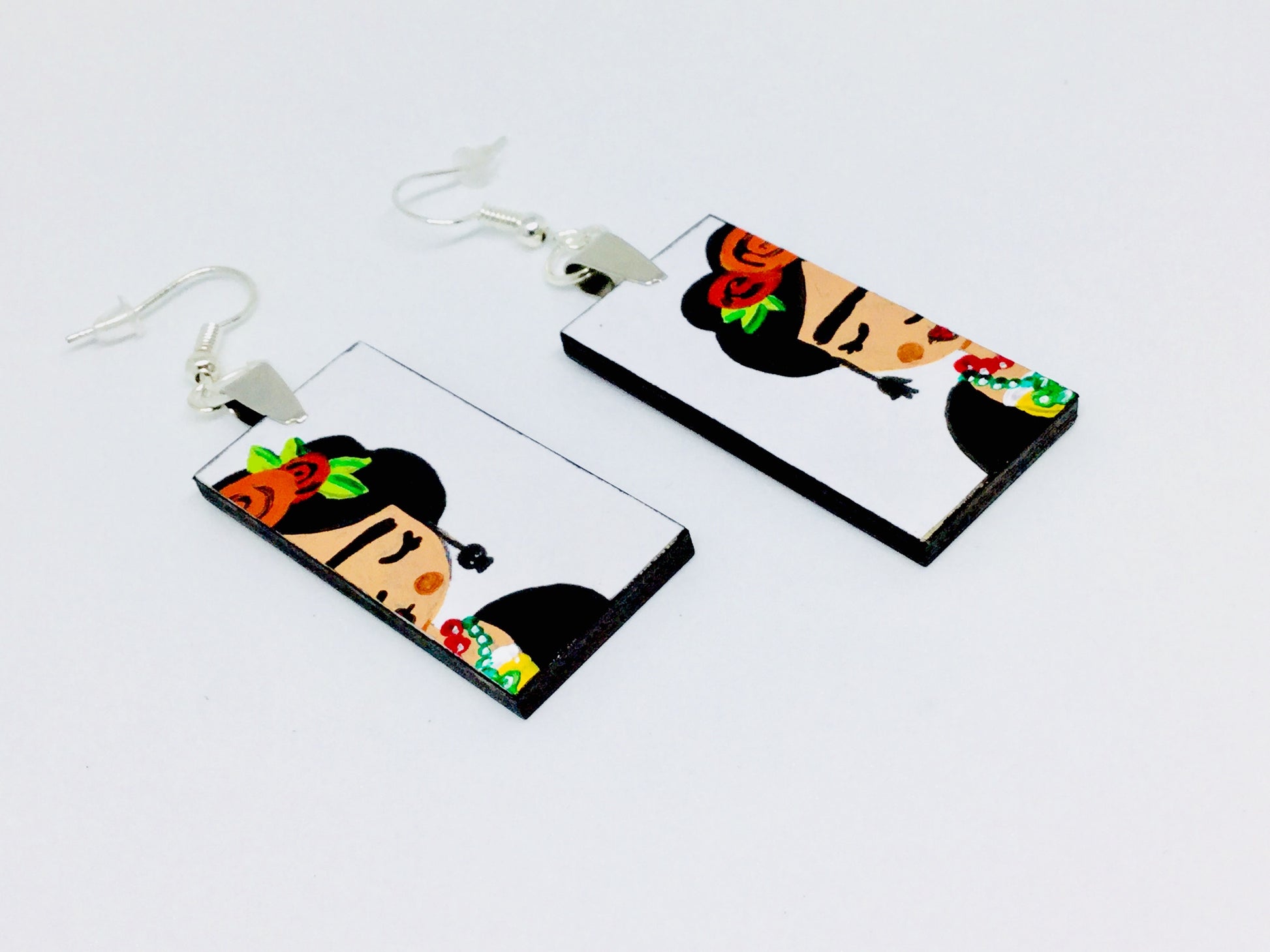 Frida earrings: Frida Kahlo inspired handpaied wooden earrings. Mexican jewelry by Fridamaniacs