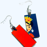 Frida Earrings: Hand painted Frida Kahlo earrings made of wood. Mexican jewelry. Acrylic blue indigo, orange, and yellow flowers. Girl gift idea. Trendy fashion. Aretes pintados a mano. Mexico folk art to wear-wearable art. Women and girls birthday gift idea