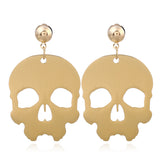 Metallic skull earrings. Mexican jewelry. Gold tone aretes de calavera