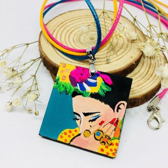 Frida Kahlo hand painted necklace pendant with colorful flowers and bright yellow dress. Wearable Art. Mexican Jewelry. Collar Pintado a mano